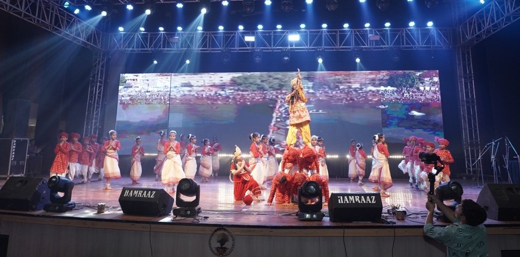 Students performing a cultural dance on stage