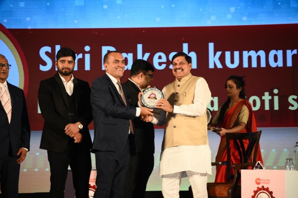 Principal being felicitated at an award ceremony