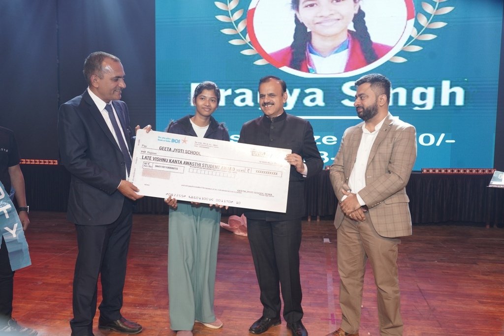 Student receiving a scholarship award on stage