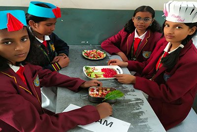 Young students with a tricolour craft activity