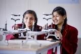 Students working with a drone during a hands-on technology session